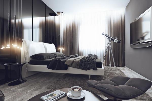 В спальне, оформленной в стиле хай-тек, можно не только отдыхать, но и находиться в течение длительного времени, занимаясь повседневными делами