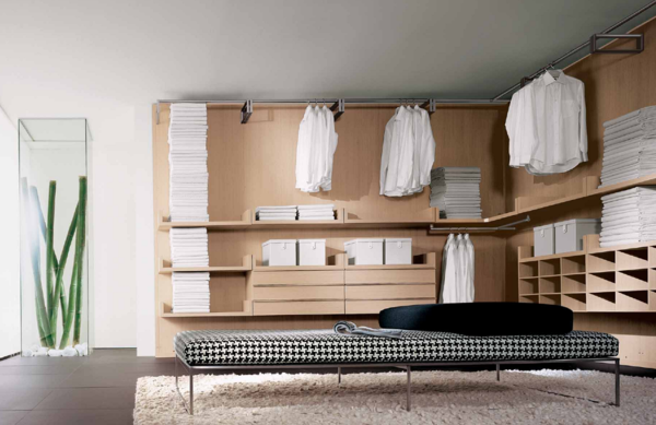 Дизайн угловой гардеробной следует подбирать в зависимости от стиля интерьера помещения 