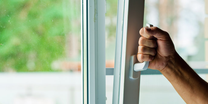 Man’s Hand Opening Window